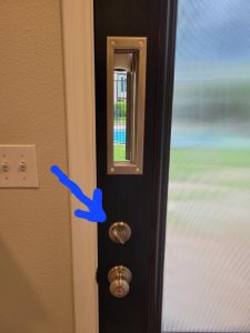 Door lock right below mail slot.