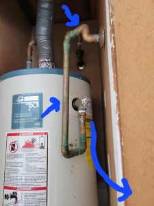 Water heater pressure relief line should go down hill to the outdoors.