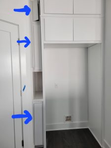 Skinny cabinets installed to cover mismeasurements.