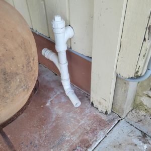 The laundry washer drains onto the back porch.